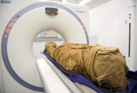 The 2,500 year-old mummified body an Egyptian female known as 'Tahemaa' is scanned at the Saad Centre of Radiography at City Univeristy in central London, on July 30, 2009. Tahemaa is believed to have been 28 years-old when she died and is thought to have lived in Luxor in Egypt. Specialists at City University hope to learn more about how she died. The mummy was donated to the Bournemouth Natural Sciences Society in 1922. Nothing is known of how she arrived in England. AFP PHOTO/LEON NEAL (Photo credit should read Leon Neal/AFP/Getty Images)